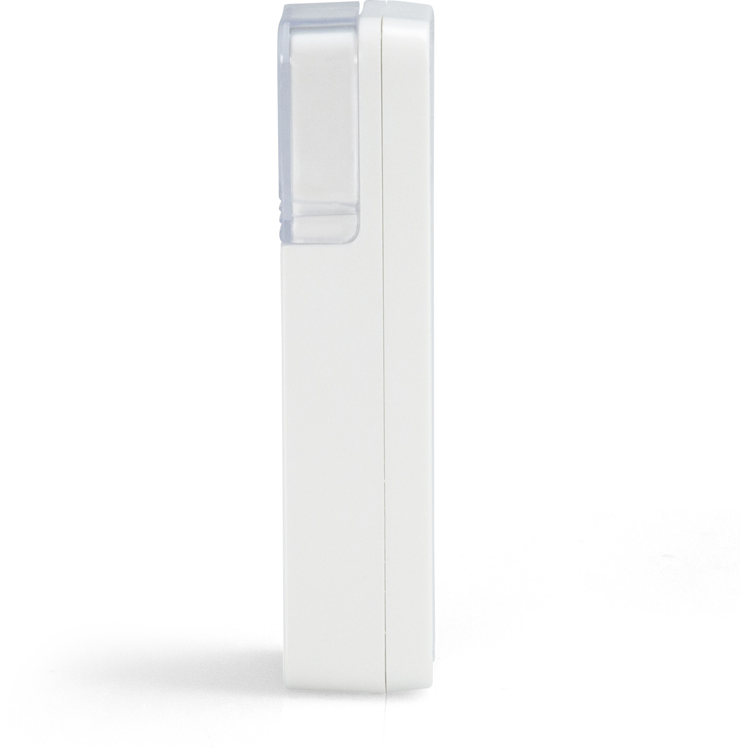 White rectangular device. Clear plastic cover on top. Shadow on the white surface.