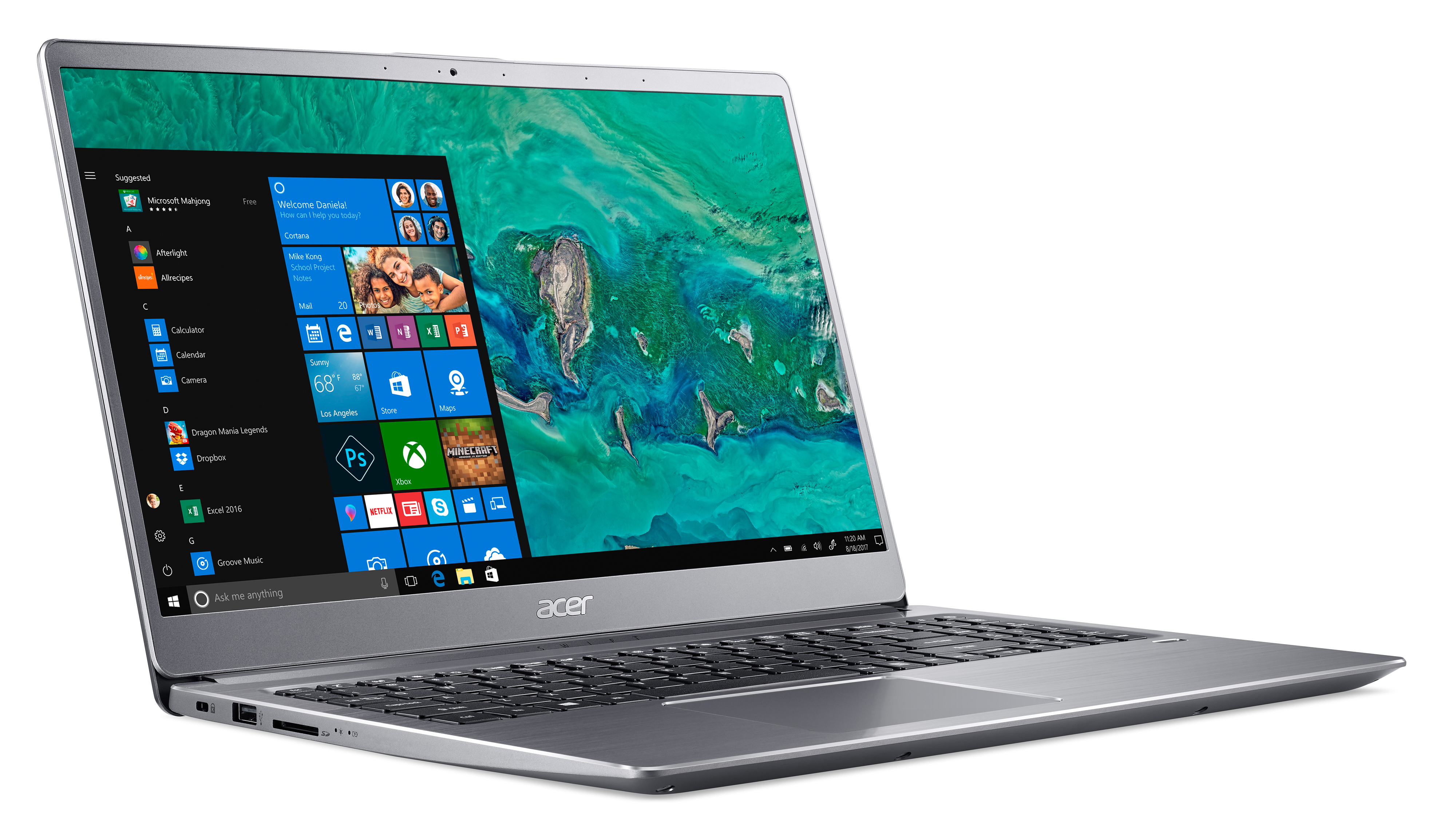 Silberner Laptop mit offenem Bildschirm. Zeigt einen Windows-Desktop mit App-Symbolen und einem Kalender. Weißer Hintergrund.