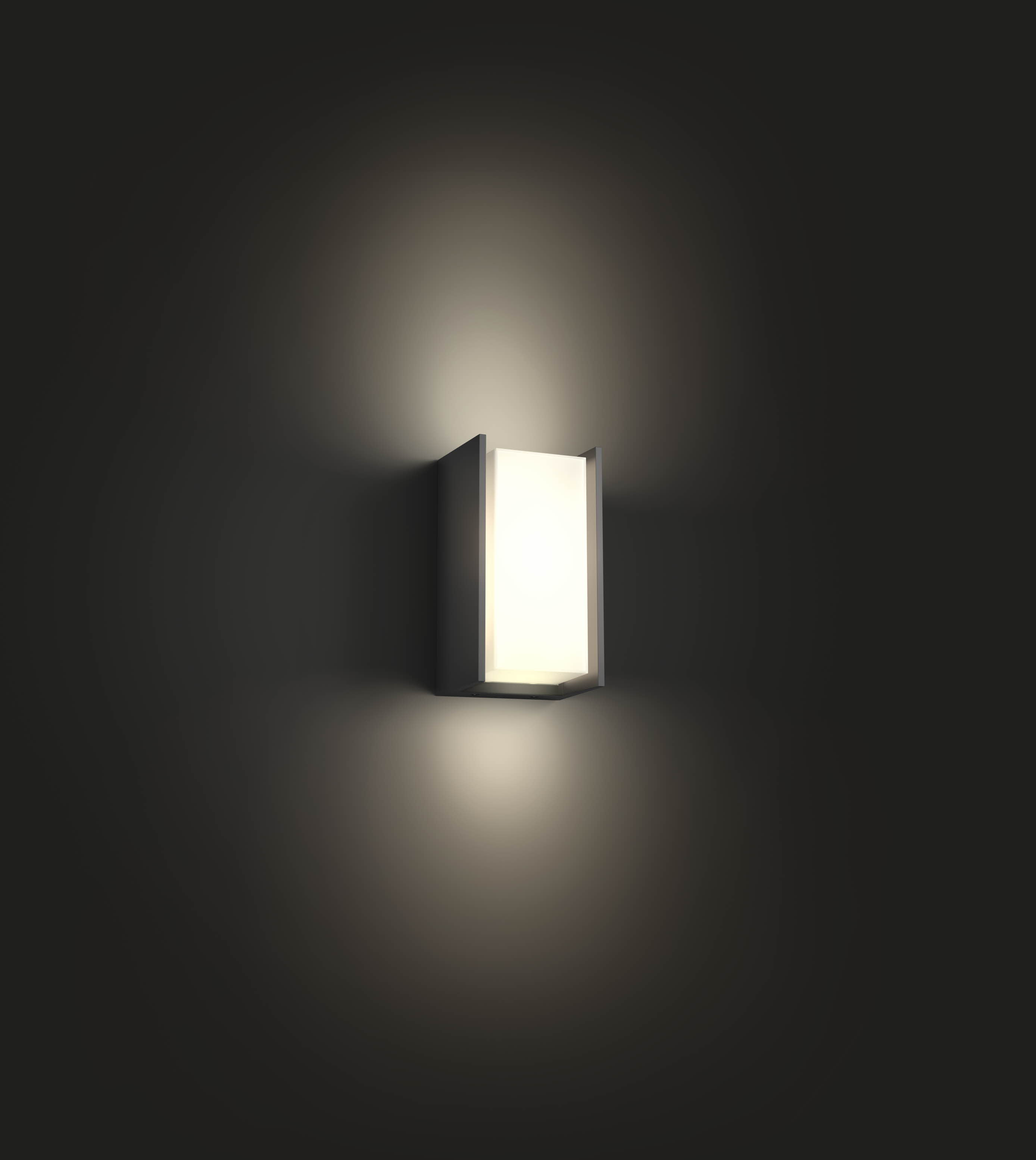 A rectangular wall lamp, lit, mounted on a dark gray wall.