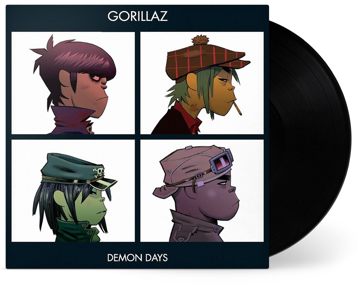 Gorillaz albumhoes met vier cartoonportretten. Een zwarte vinylplaat is rechts zichtbaar.