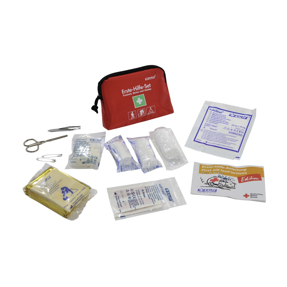 Kit di pronto soccorso con forniture. Borsa rossa con croce bianca, bende, forbici e altri oggetti.