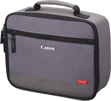 Un sac d'appareil photo Canon gris avec une poignée et une fermeture éclair sur blanc.