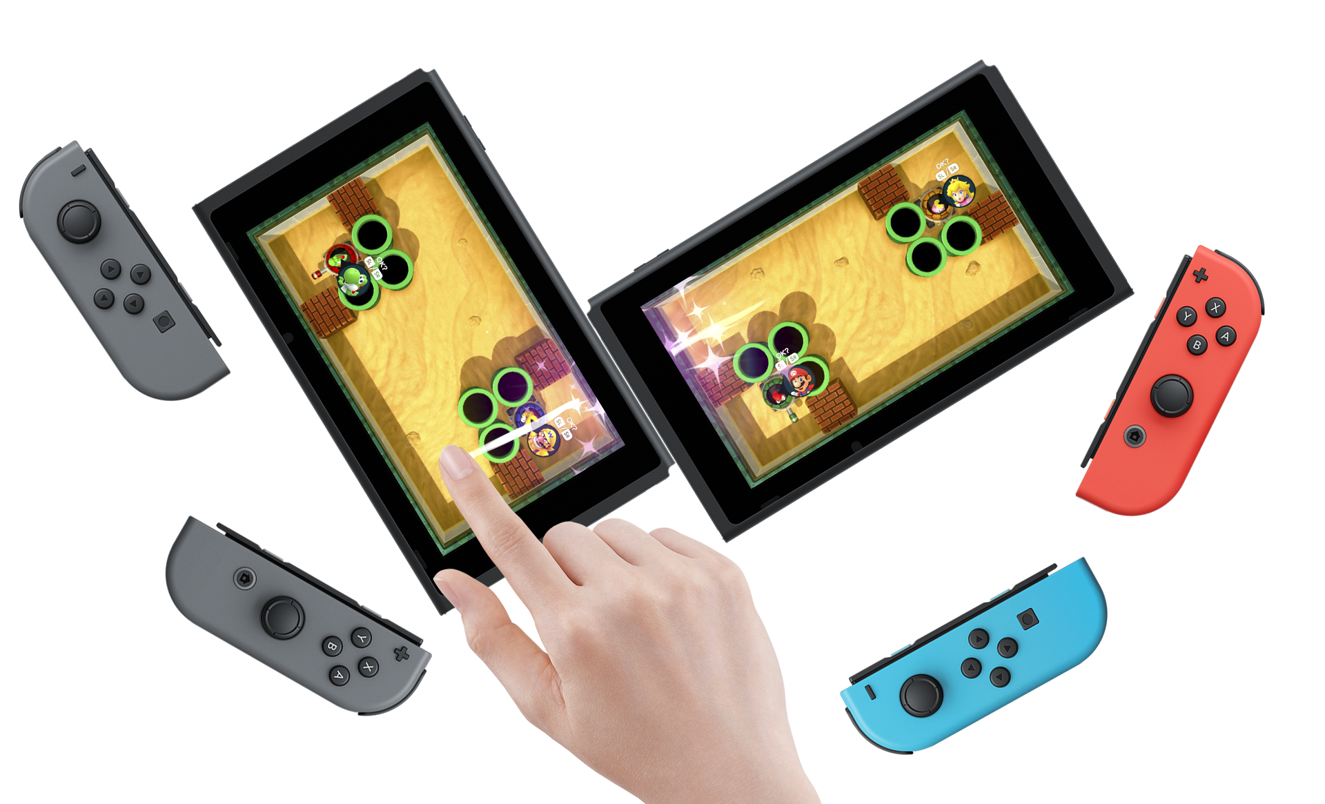 Zwei Nintendo Switch Konsolen mit Joy-Cons, die ein Spiel spielen. Ein Finger berührt einen Bildschirm.