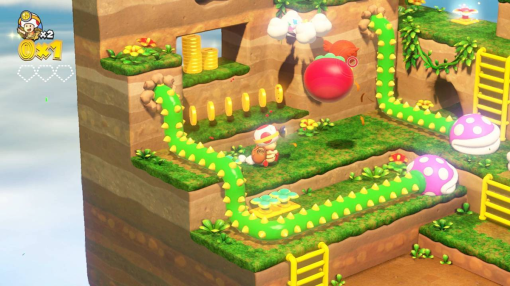 Une scène de jeu vidéo montre un personnage sur un chemin vert avec des pièces, des champignons et une tomate flottante.