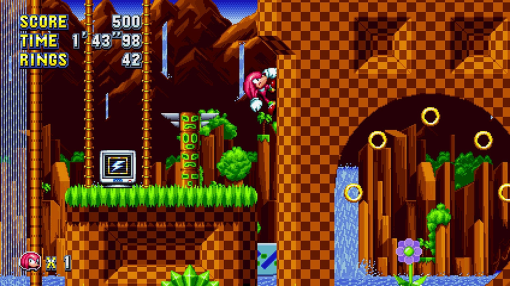 Scena del gioco Sonic the Hedgehog: Knuckles salta sopra una cascata.