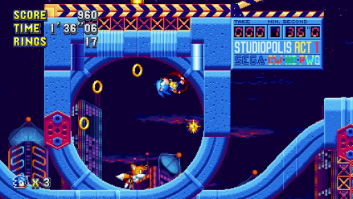Sonic the Hedgehog in un ambiente di videogiochi con una città e anelli.