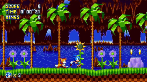 Sonic the Hedgehog che corre in una scena di videogioco classico con Tails. Erba verde e cielo blu.