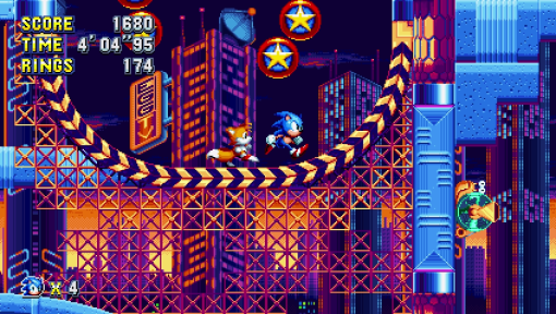 Scena di videogioco. Sonic e Tails corrono su una piattaforma in una città illuminata al neon.