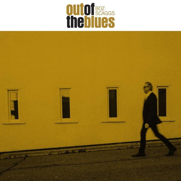 Pochette d'album avec un homme marchant sur une route et un mur jaune.
