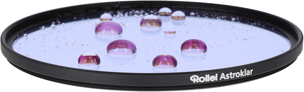 Un filtre rond avec des gouttelettes d'eau. Le filtre est dans un cadre noir, les gouttelettes sont violettes.