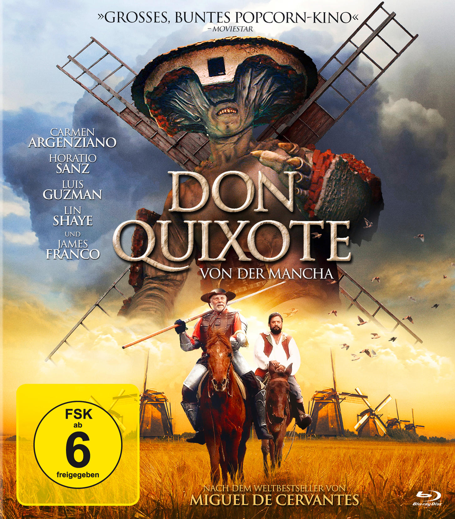 Filmposter für 'Don Quijote'. Es zeigt zwei Männer auf Pferden mit Windmühlen im Hintergrund.
