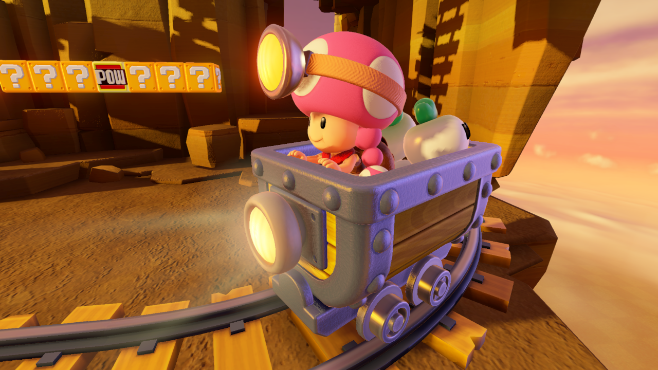 Toadette in een mijnkar op een baan, met vraagtekenblokken en een zonsondergangachtergrond.