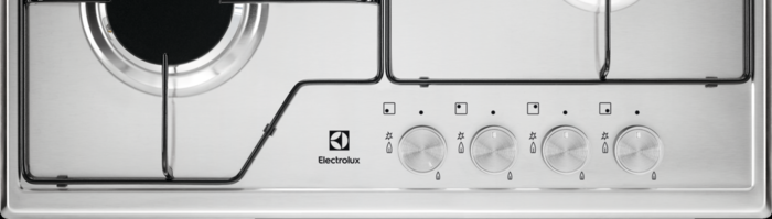 Közelkép egy rozsdamentes acél Electrolux főzőlapról négy ezüst gombbal.