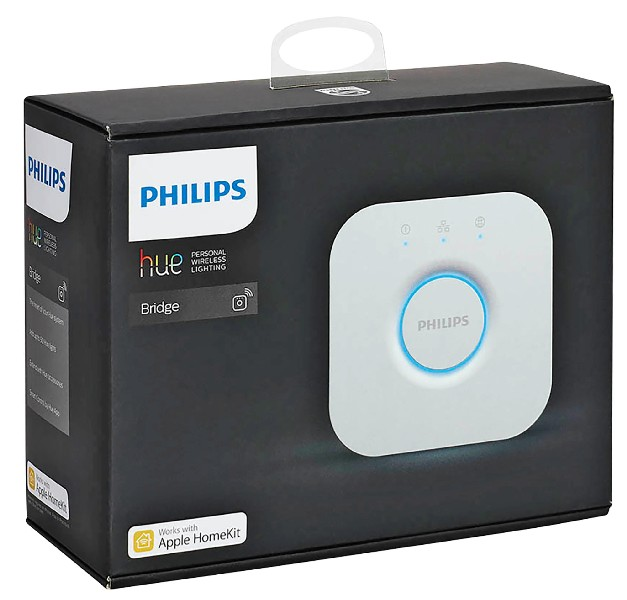 Una caja negra con el logo de Philips y un dispositivo blanco, posiblemente un puente, en la parte delantera, fondo blanco.