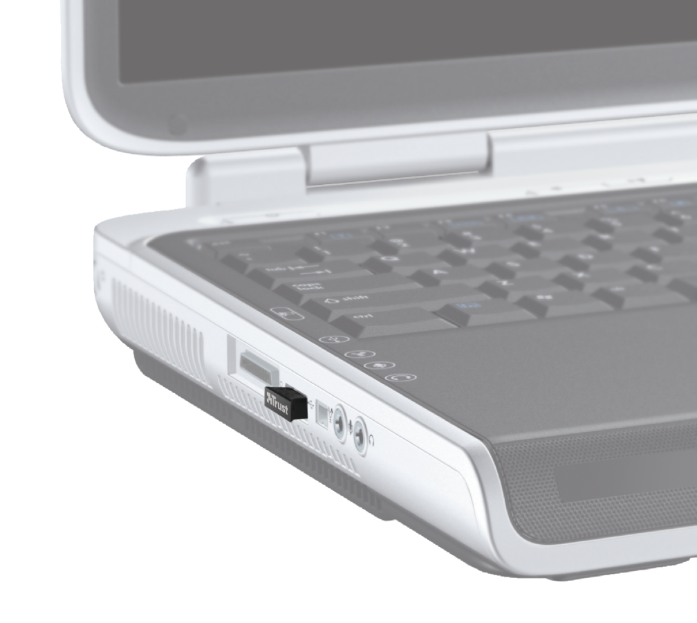 Laptop oldala a behelyezett Trust USB-vevővel, közelkép.