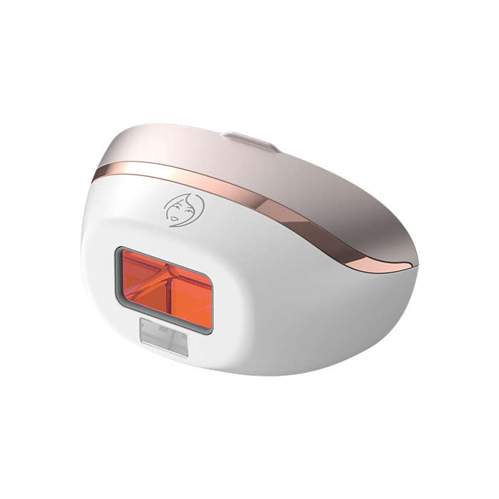 A white and rose gold hair removal device. Features an orange light window and small face icon.