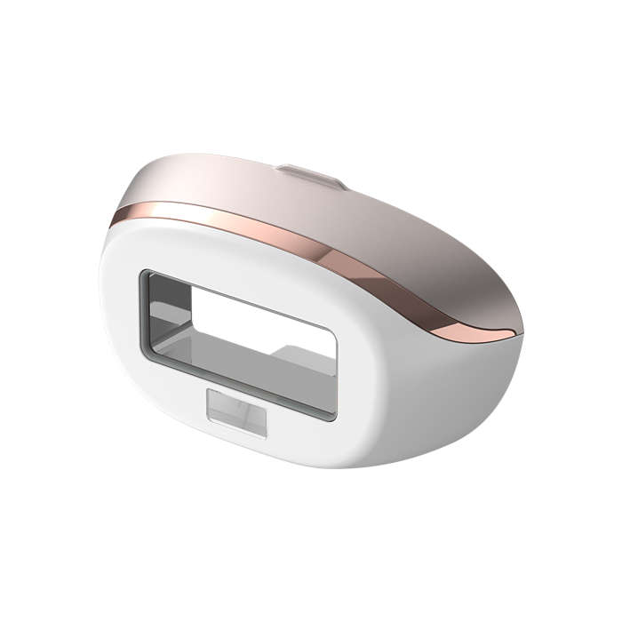 A white and rose gold hair removal device, angled on a white background.