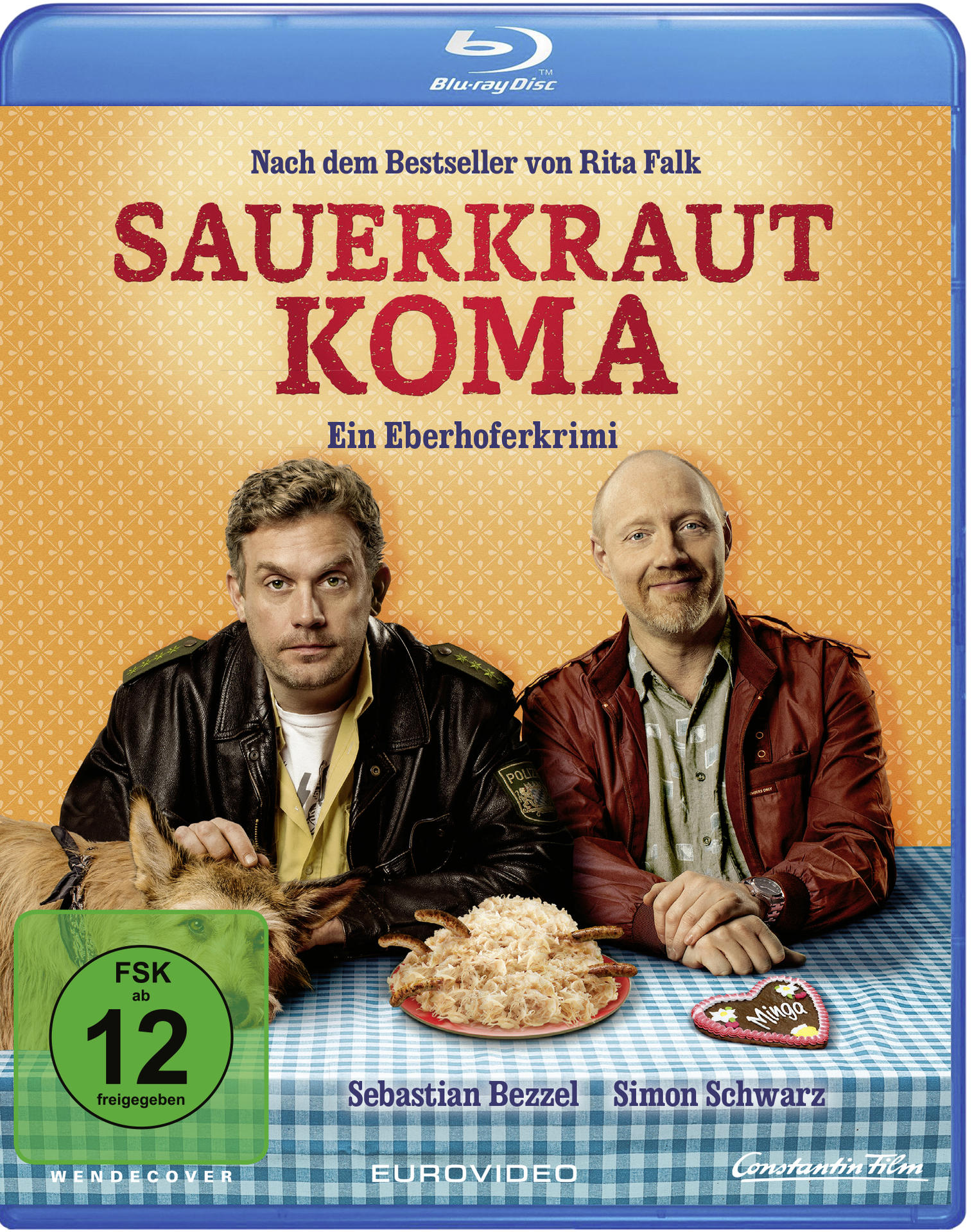 Sauerkraut Koma Blu-ray-Cover mit zwei Männern, einem Hund und einem Teller Sauerkraut auf einem Tisch.