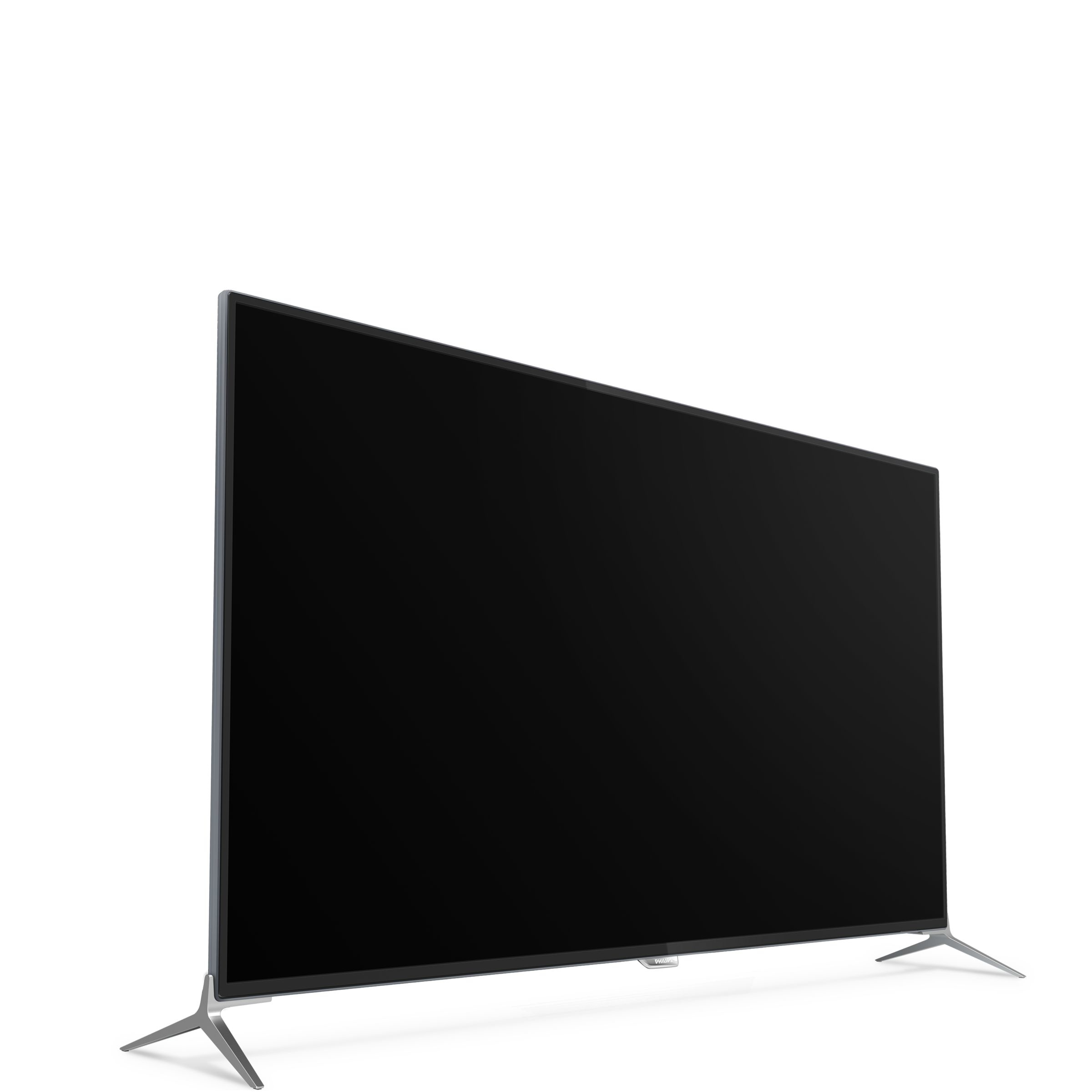 Salón moderno con un televisor grande montado en la pared, dos sofás grises y una mesa de centro.