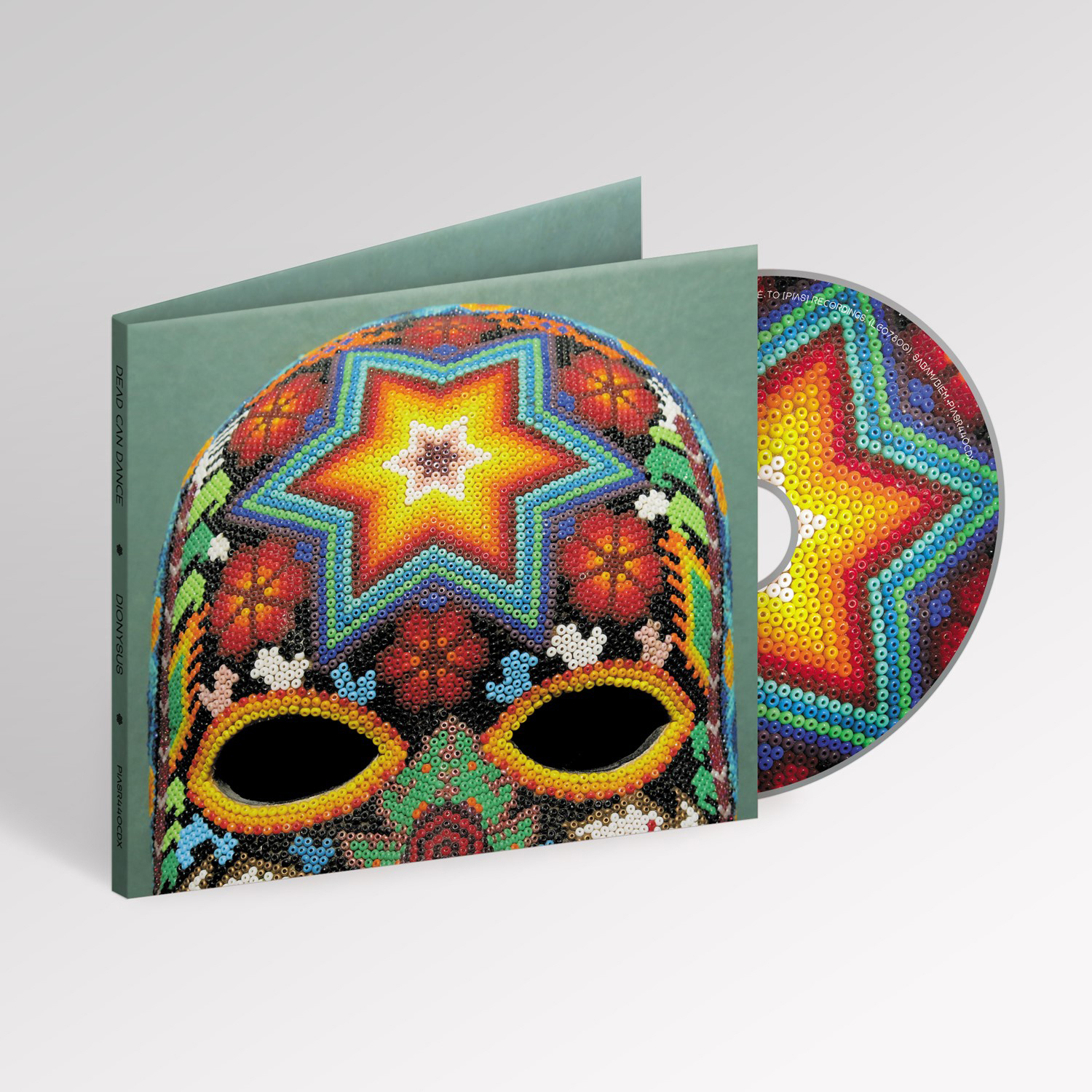 CD-Albumcover für Dead Can Dance's Dionysus. Zeigt eine farbenfrohe, perlenbesetzte Maske.
