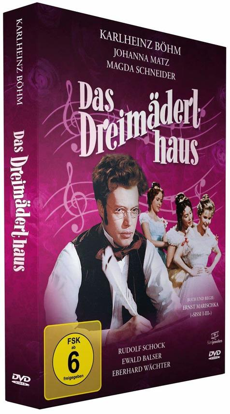 DVD-Box mit einem Mann im Anzug, drei Frauen und Noten auf pinkfarbenem Hintergrund.
