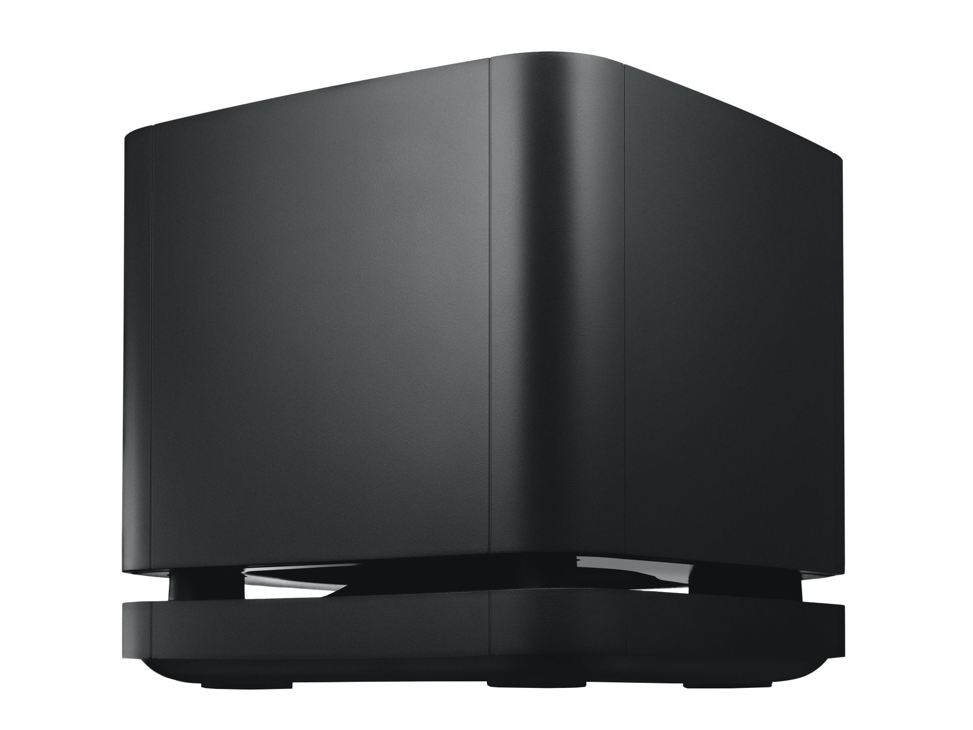 A black subwoofer with a square design, on a black surface. It has a minimalist appearance.