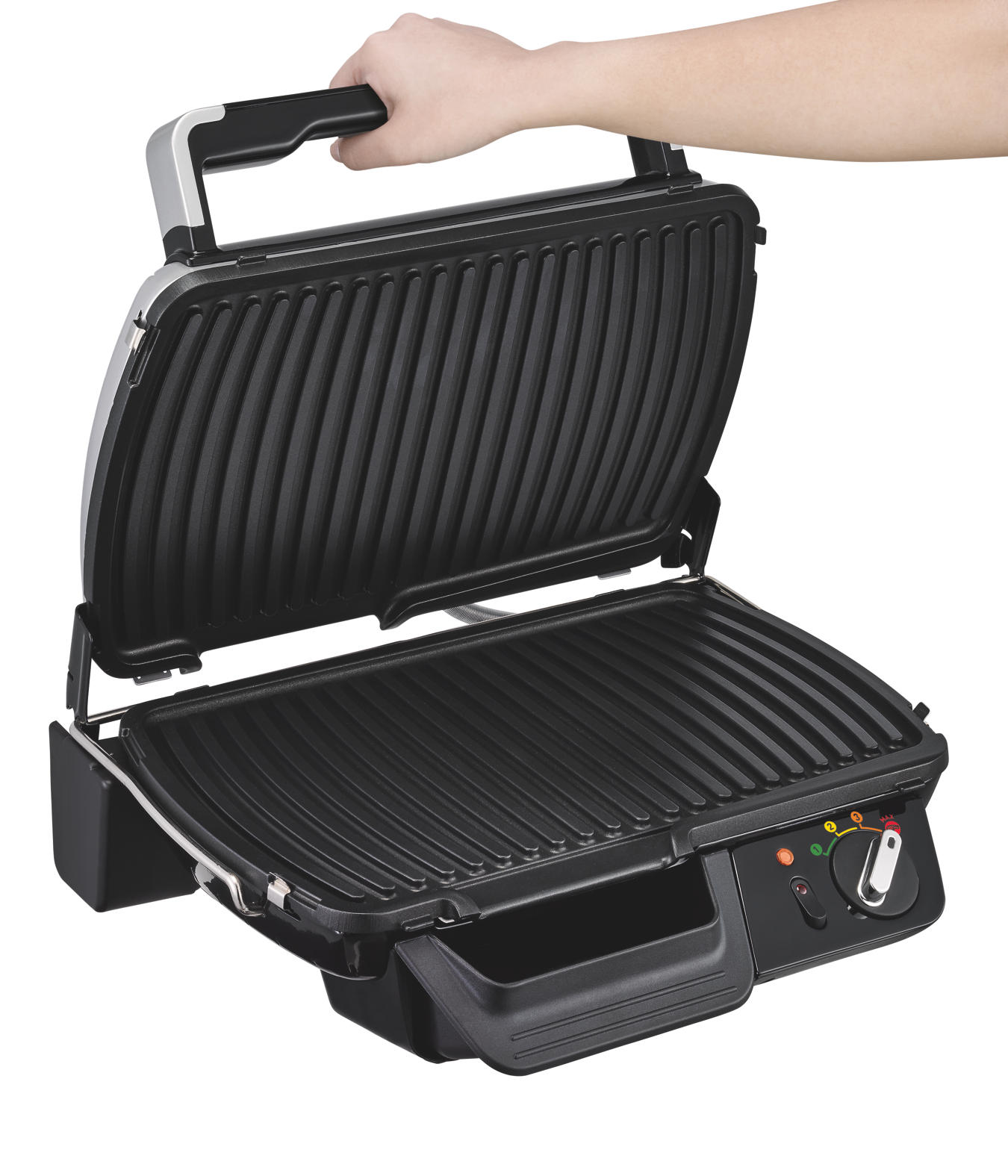Open black grill with a hand holding the handle. The grill is open, showing the grilling surface.