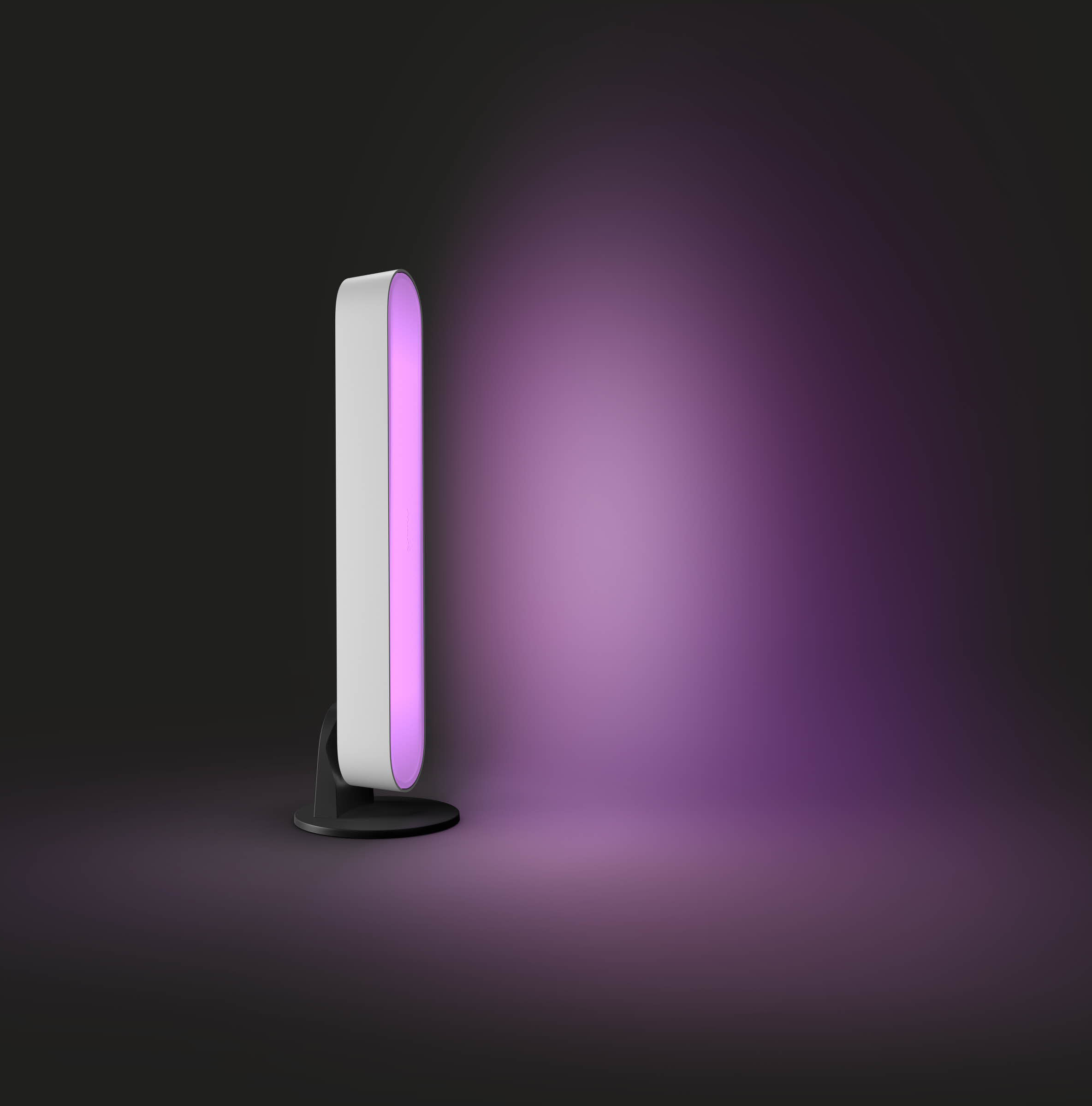 White and purple light fixture, standing upright, with a dark background.
