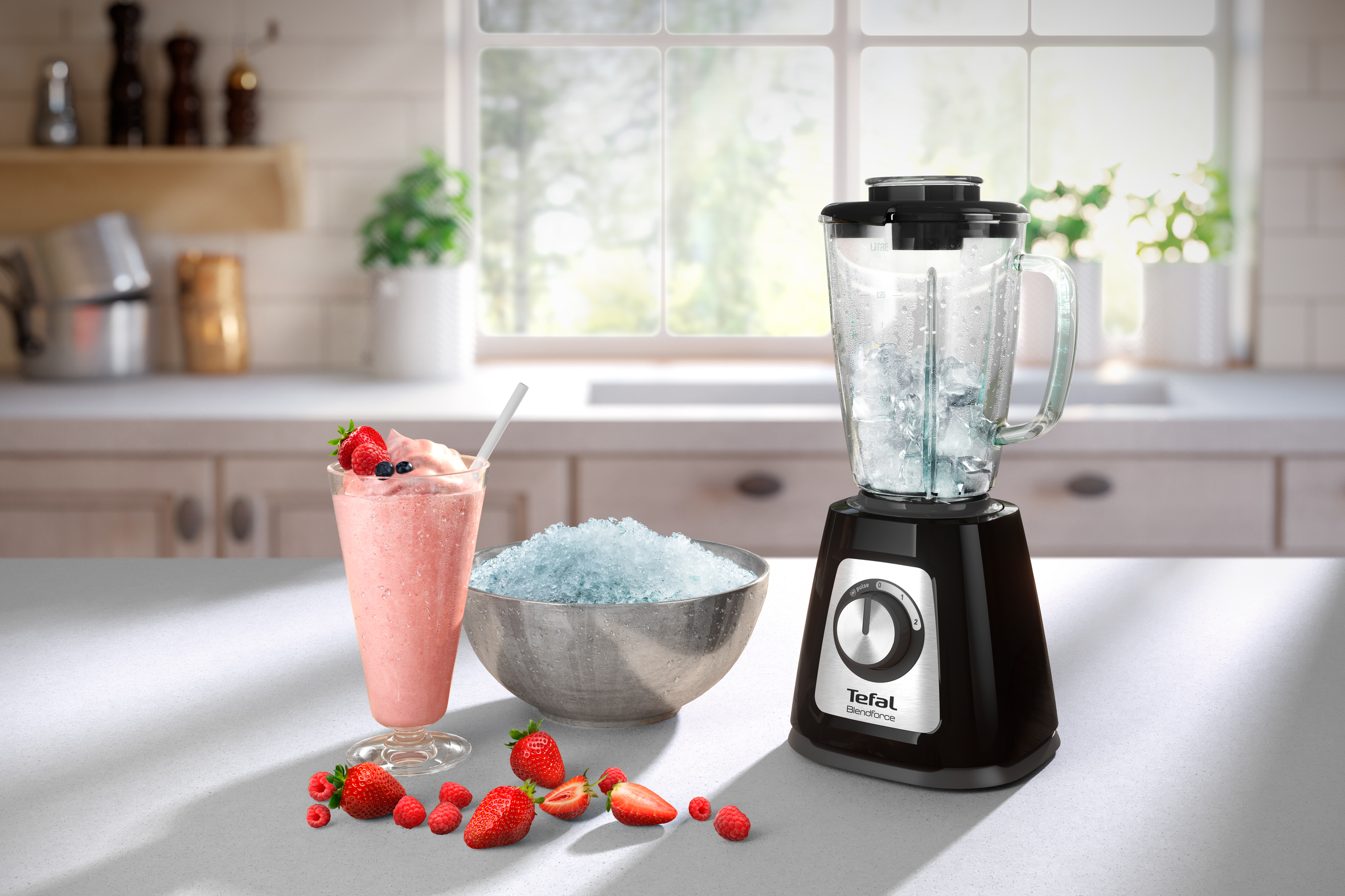 Blender with ice, smoothie, and strawberries on a table in a kitchen setting.