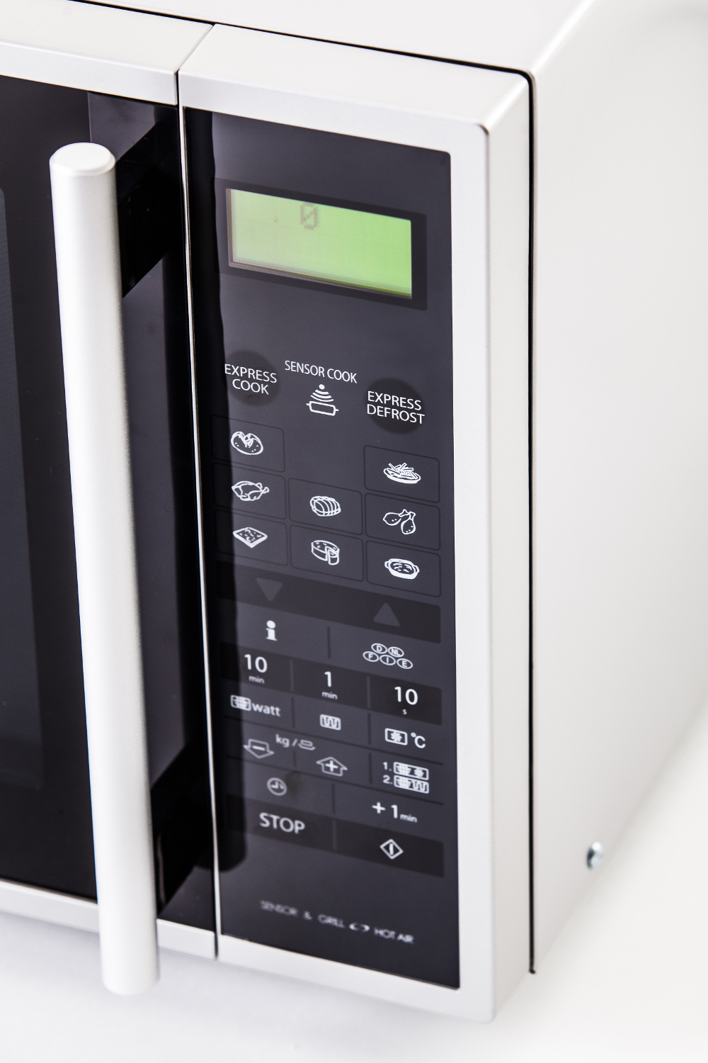 A white microwave oven control panel is shown. Buttons include Express Cook, Sensor Cook, and Express Defrost.
