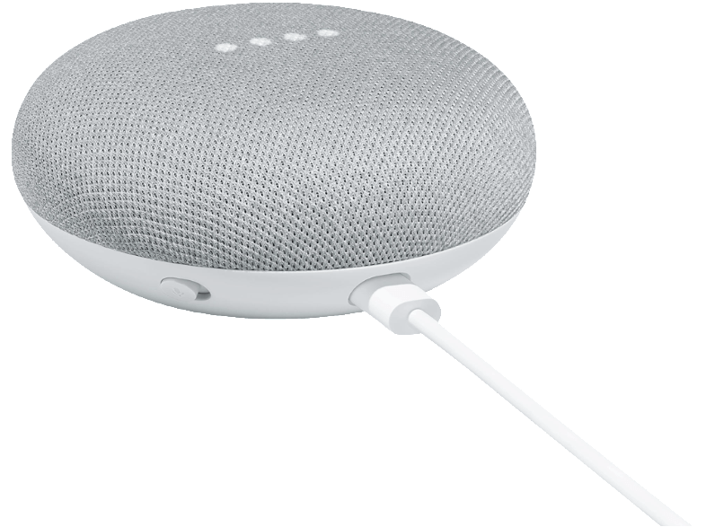 Un altavoz inteligente gris pequeño con una base blanca. Un cable de alimentación blanco está enchufado.