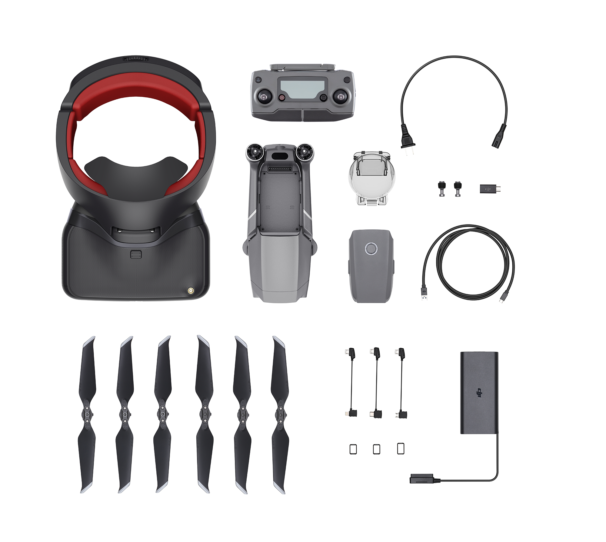Drone-onderdelen op wit. Inclusief een headset, afstandsbediening, oplader, propellers en een batterij.