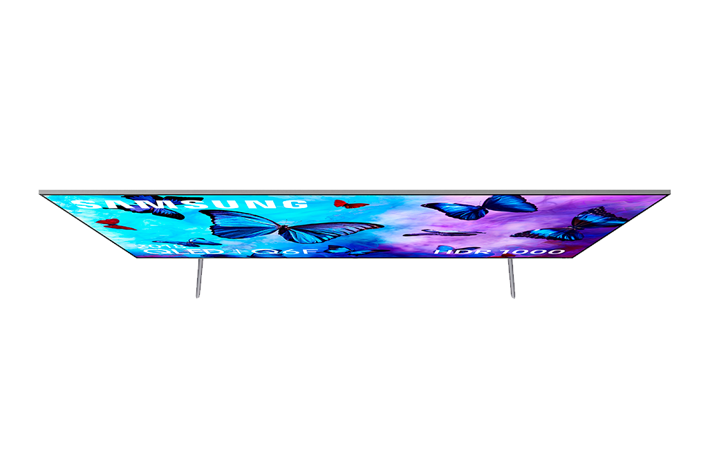 Vista superior de TV Samsung con mariposas. Palabras 'SAMSUNG', 'QLED + Q6F' y 'HDR 1000' visibles.