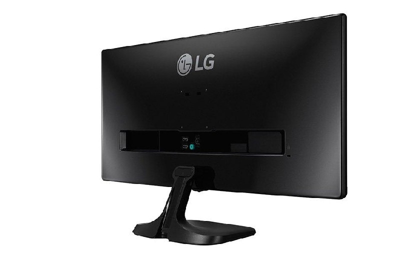 Vista trasera de un monitor LG negro. La pantalla está en blanco. El soporte es negro y el logotipo es visible.
