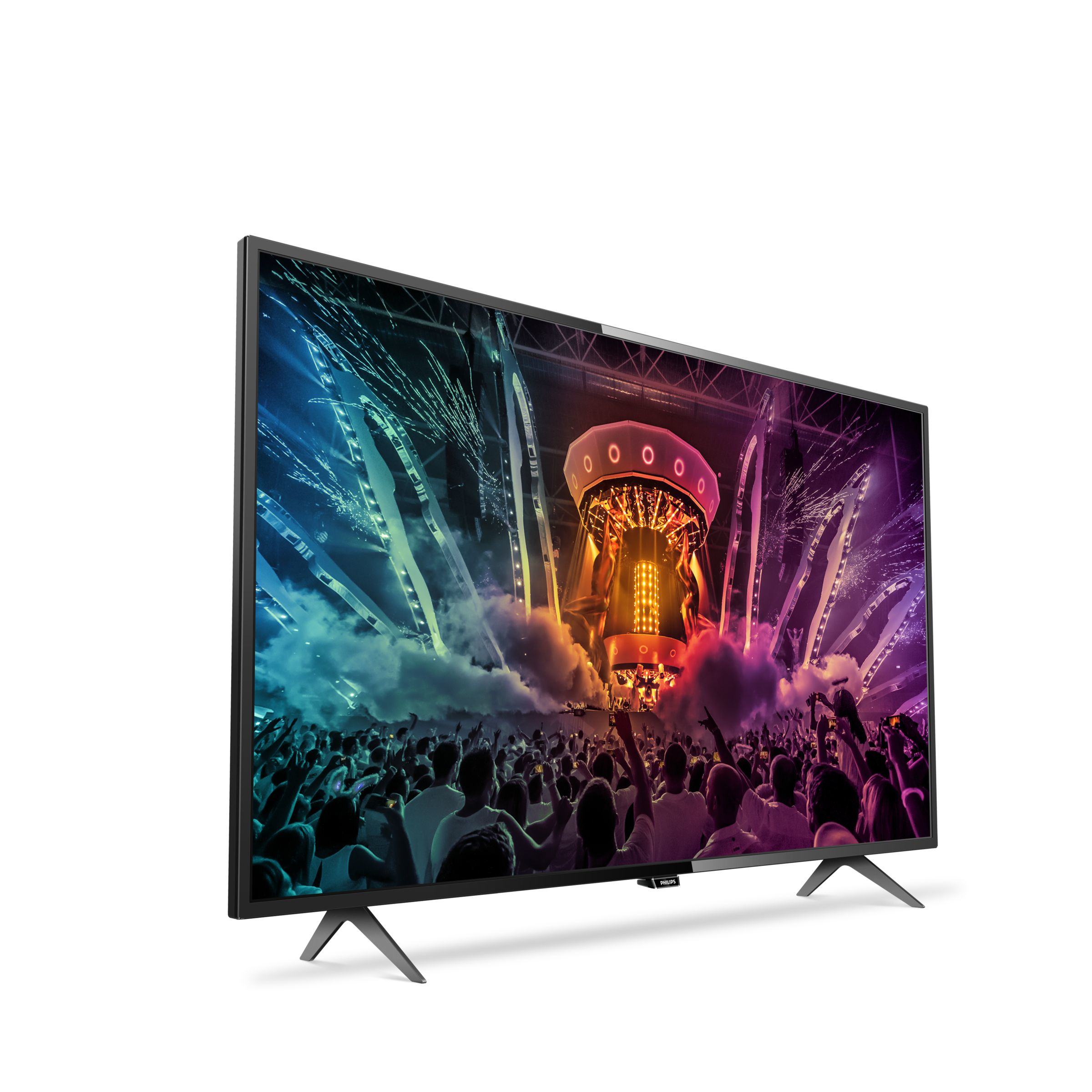 Televisor de pantalla plana grande que muestra un concierto. El televisor está sobre fondo blanco.