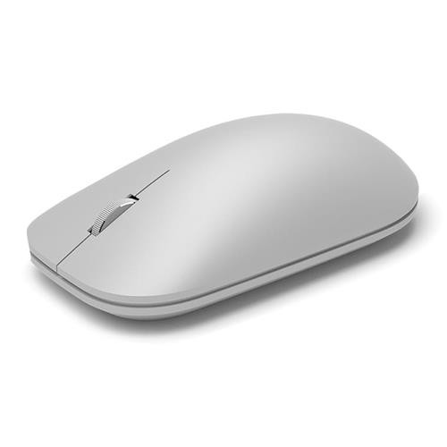 Un ratón inalámbrico gris claro. Tiene una rueda de desplazamiento y un diseño elegante y minimalista.