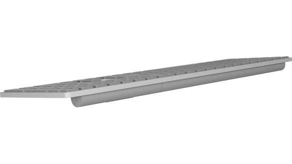 Un teclado de computadora gris, vista lateral, con un diseño elegante.
