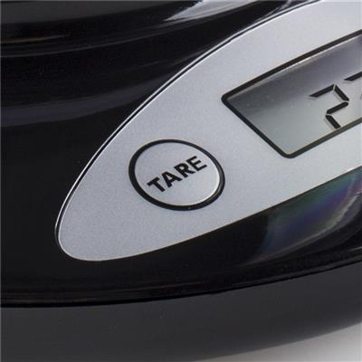 Black scale detail. Silver oval with 'TARE' button. Digital display shows a number. Black surface reflects light.