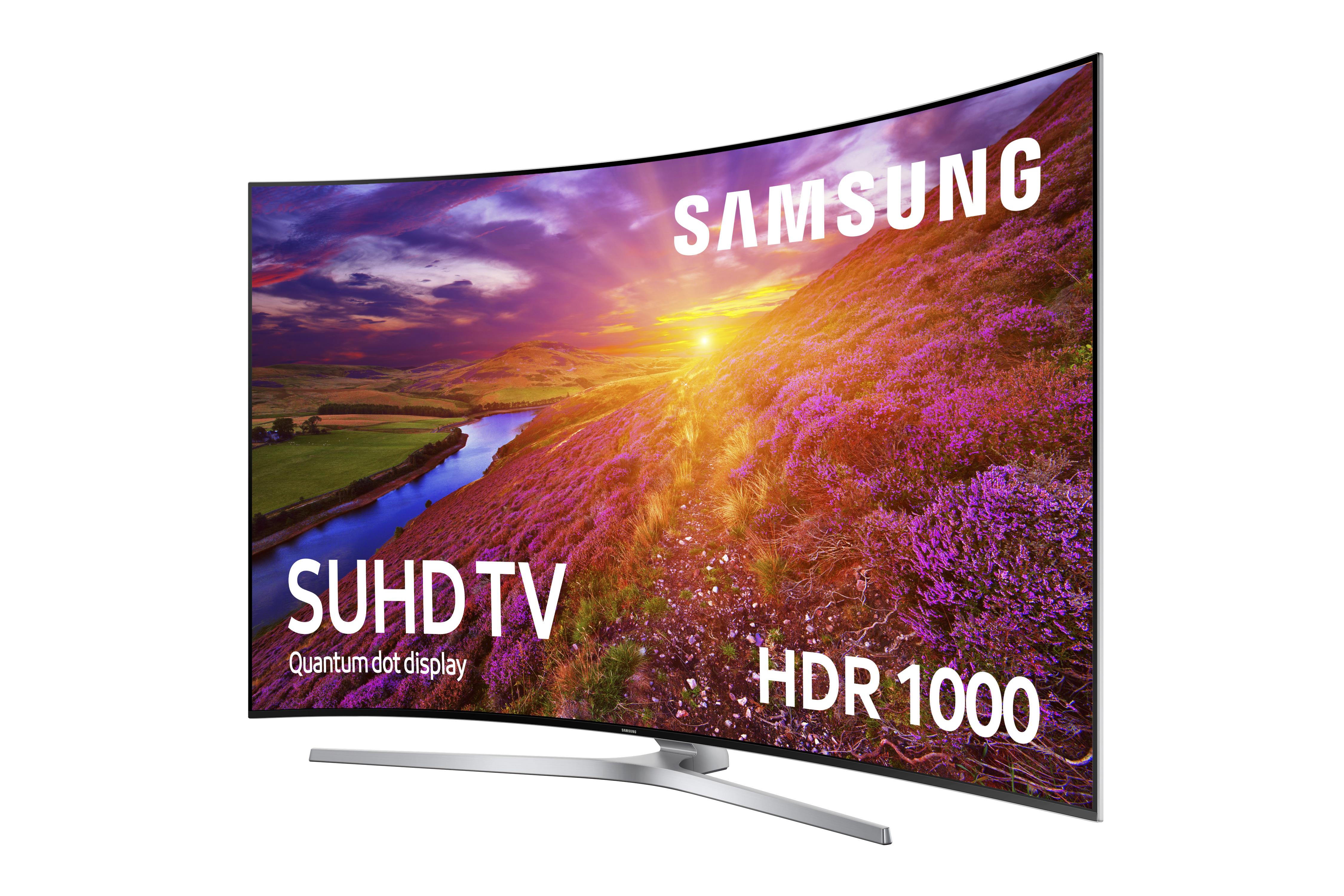 TV Samsung SUHD curvo que muestra un paisaje con flores moradas y agua.