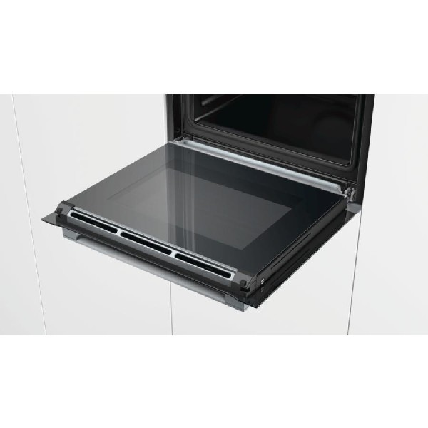 Horno abierto con puerta de cristal, interior visible.