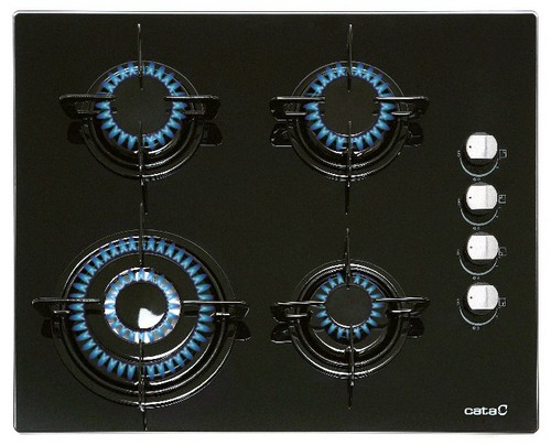 Una placa de gas negra con cuatro quemadores, cada uno con llamas azules.