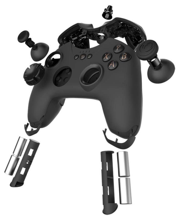 Mando de juego negro desmontado. Botones, joysticks y otros componentes separados. Fondo blanco.