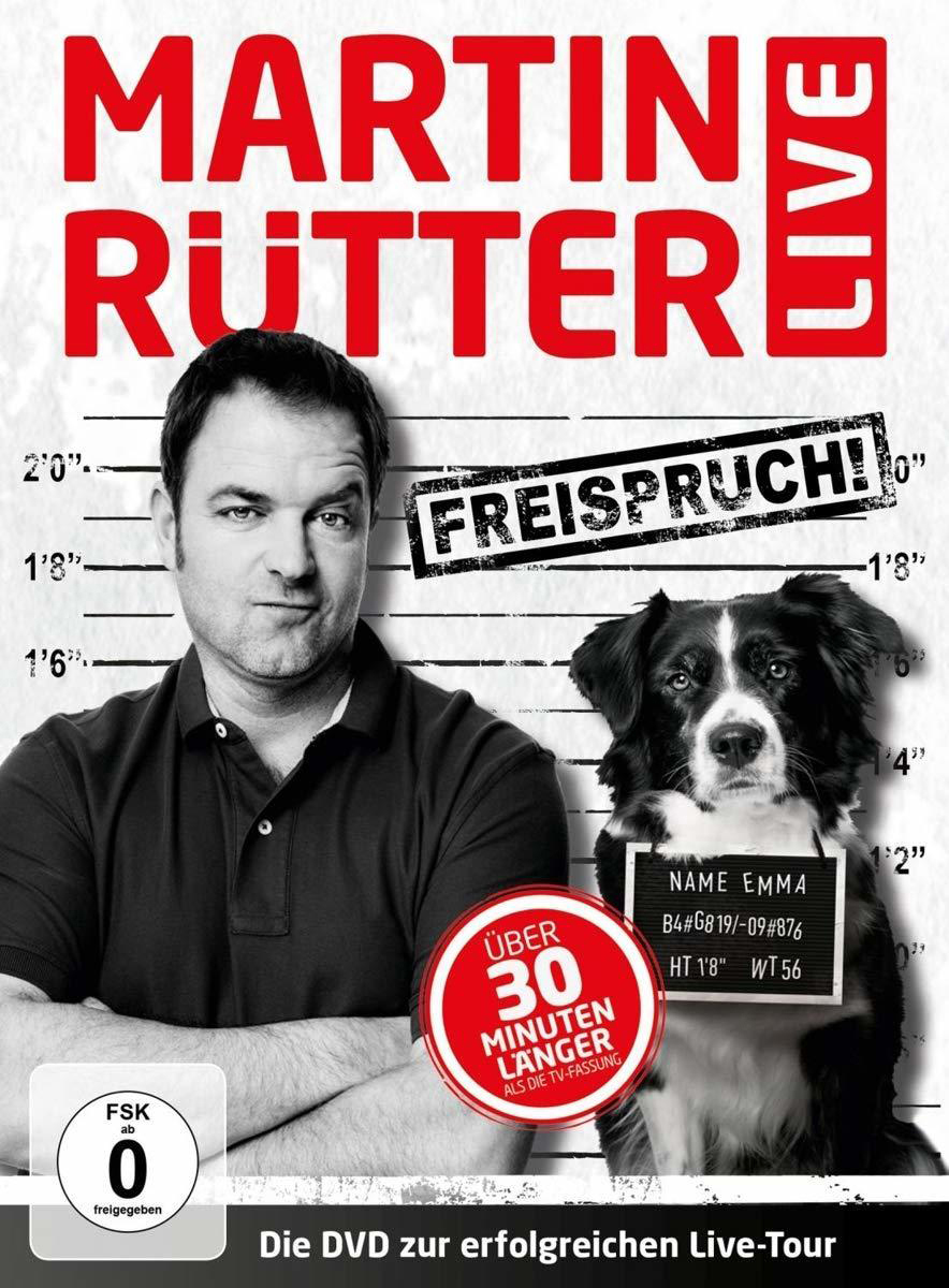 Martin Rütter Live DVD-Cover. Mann und Hund vor einer Polizeireihe.