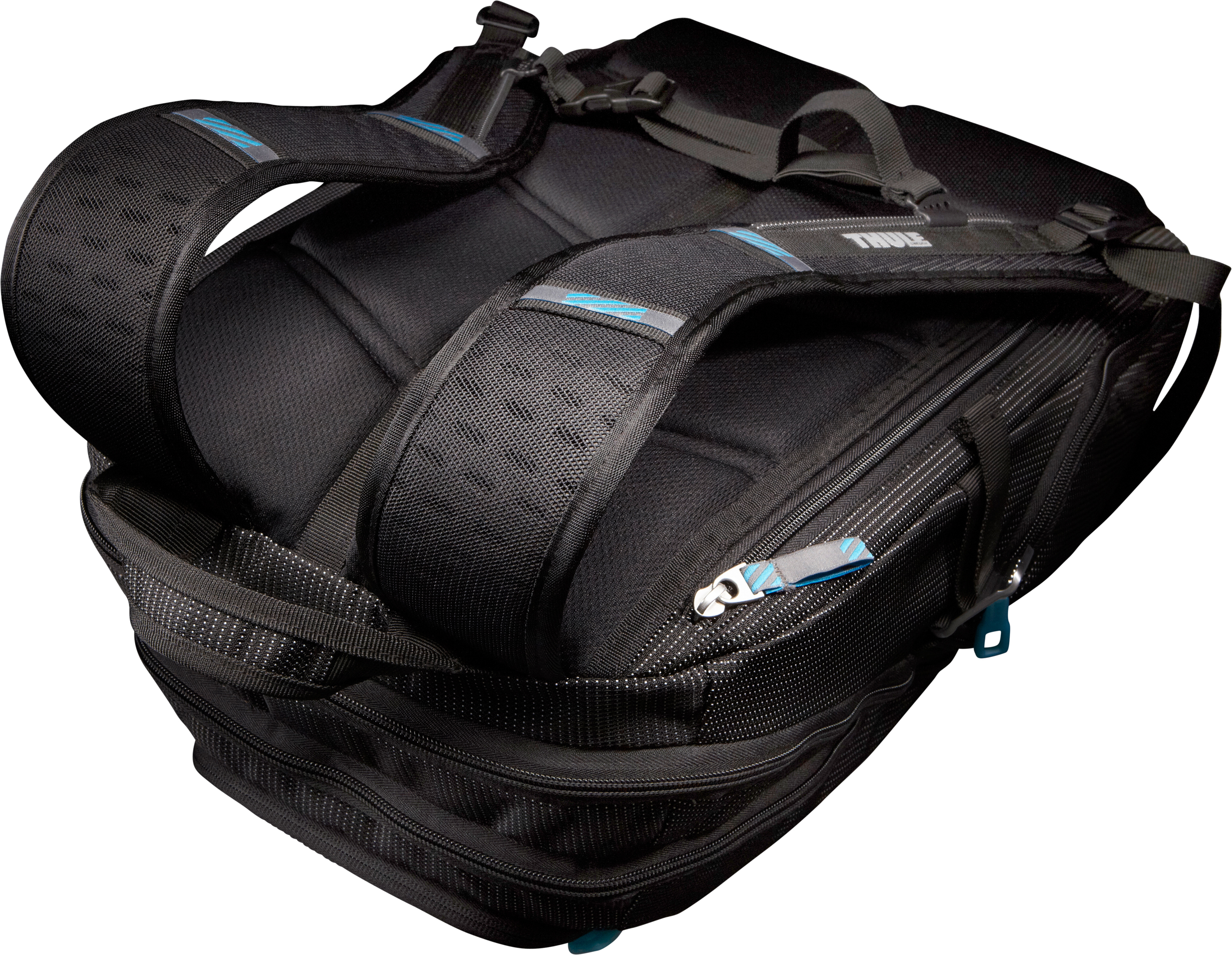 Mochila negra con correas acolchadas y detalles azules, vista desde arriba.