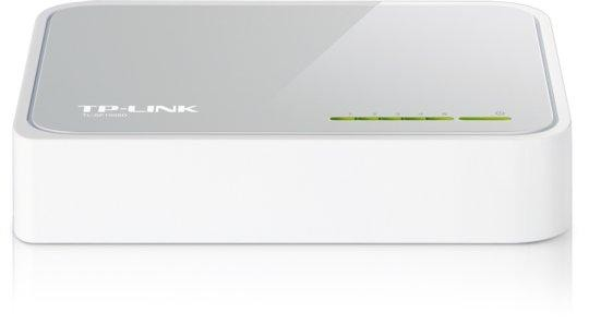Un enrutador TP-Link blanco. Es rectangular con una parte superior brillante y luces verdes. El logo TP-Link es visible.