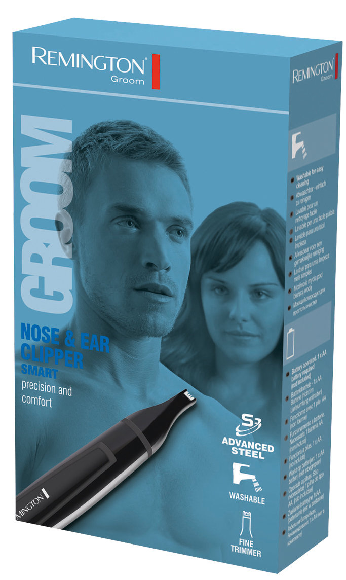 La caja muestra a un hombre y una mujer. Un cortapelos para nariz y orejas está al frente. La caja dice 'Remington Groom'.