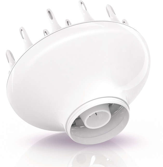 Witte haardroger diffuser op een wit oppervlak met reflectie.