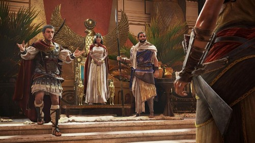 Escena de un videojuego, con figuras con atuendo del antiguo Egipto. Hay un trono al fondo.