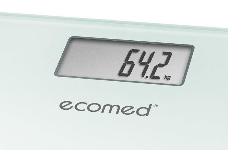 Una báscula digital con una pantalla que muestra '64.2 kg'. La marca 'ecomed' está debajo de la pantalla.