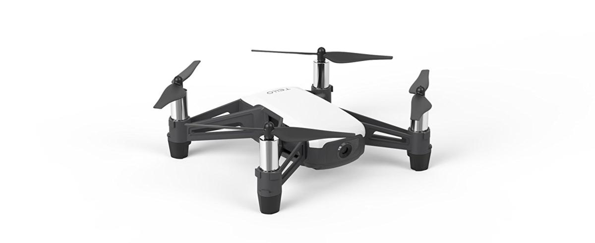Un dron blanco con hélices y patas negras sobre un fondo blanco. La palabra TELLO está en la parte superior.